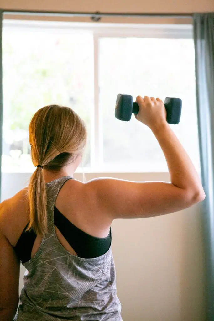 Woman lifting a dumbbell with one hand