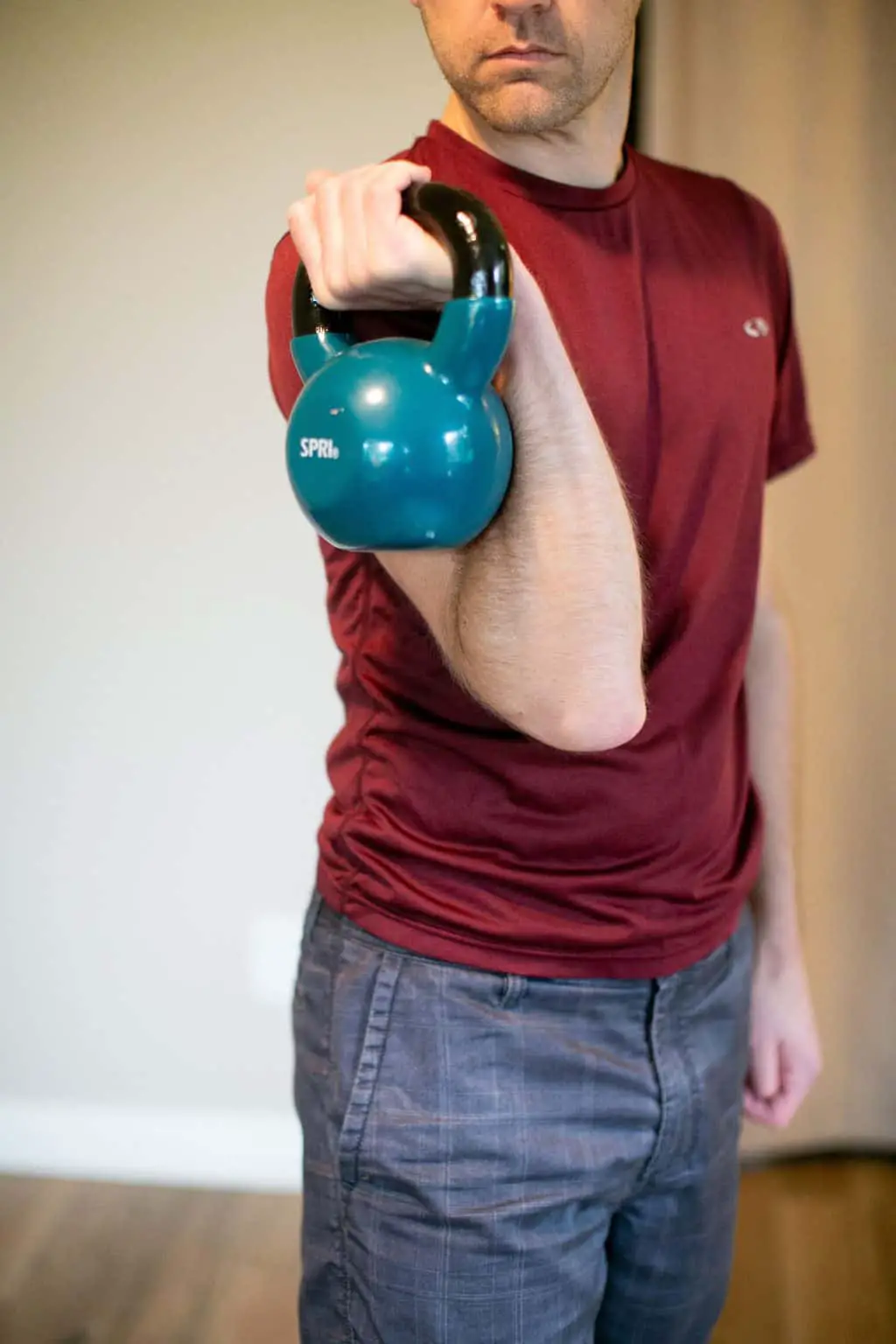 Man using a kettlebell