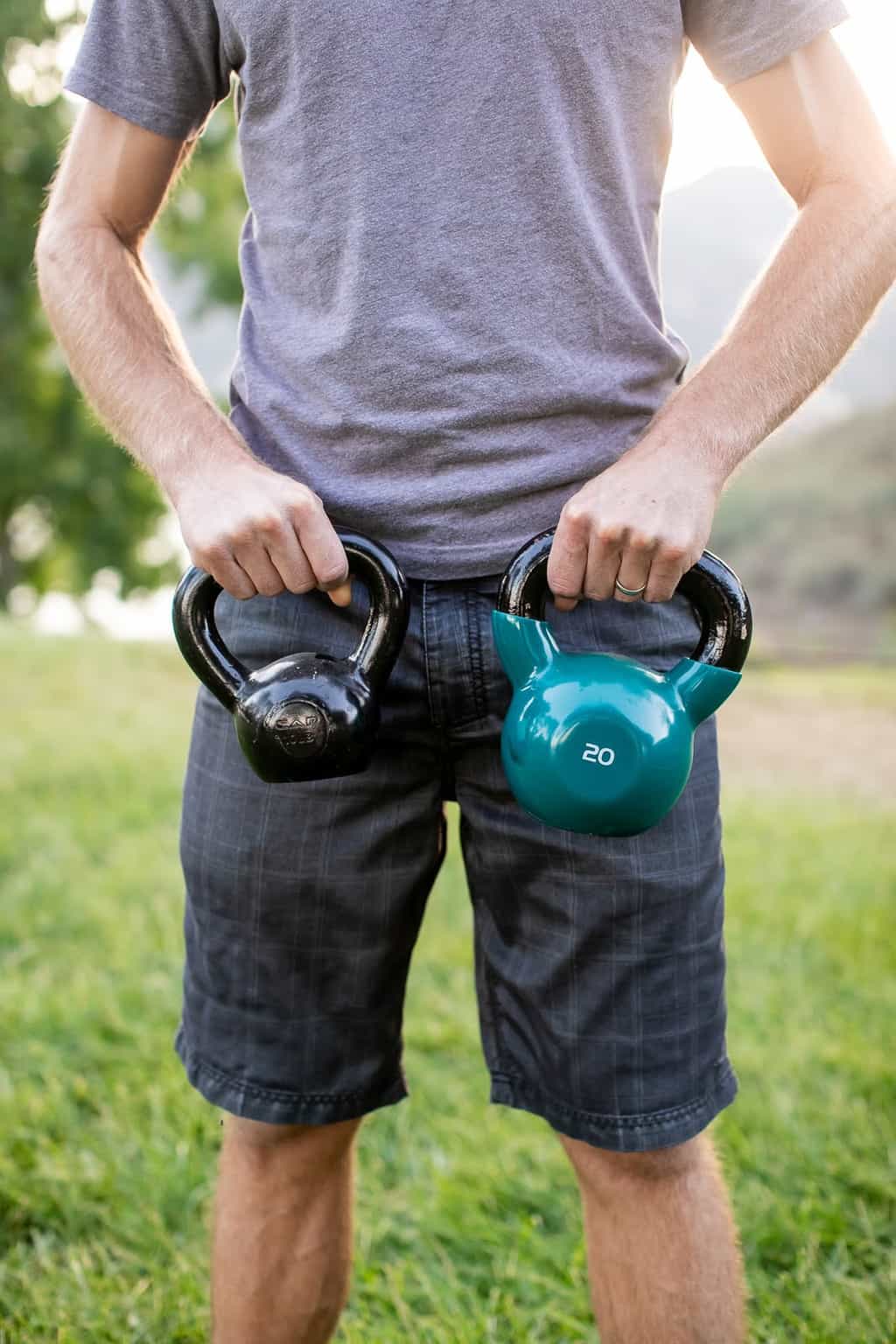 Man carrying two kettebells